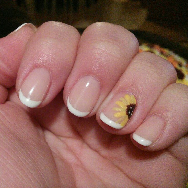 Chic French Tip Nail Design with a Vibrant Sunflower Accent