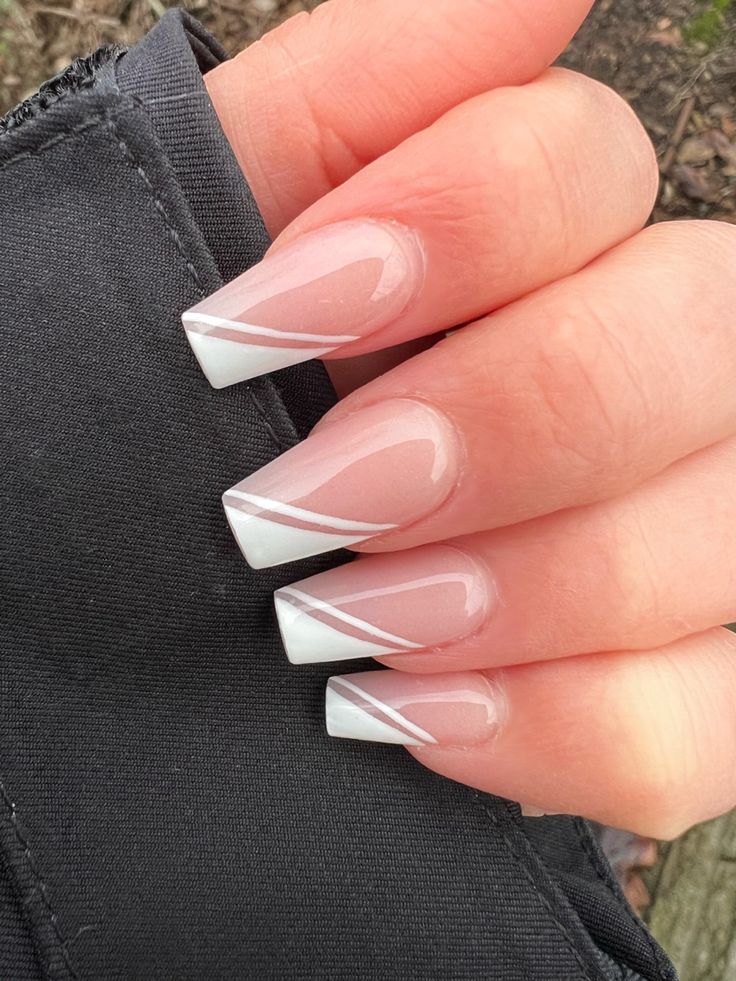 Sophisticated French Tip Nail Design with Modern Diagonal Accents.