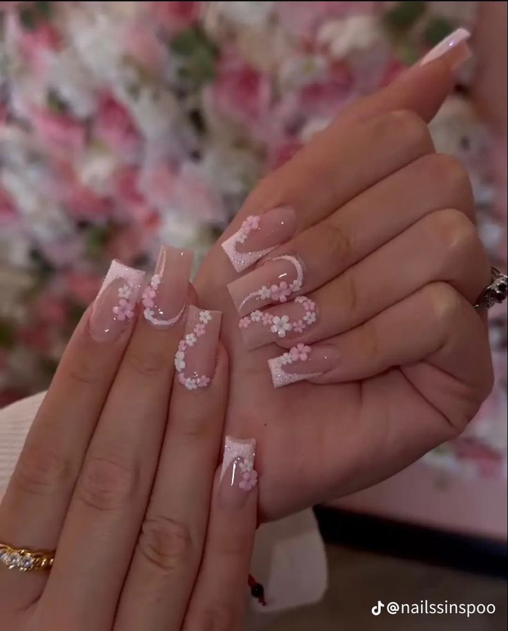 Chic Soft Pink Floral Nail Design with Elegant French Tips