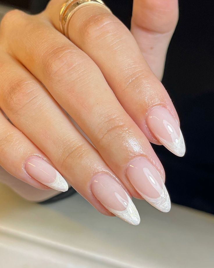 Chic Soft Pink Almond Nails with Crisp White Tips: Subtle Elegance for Any Occasion.