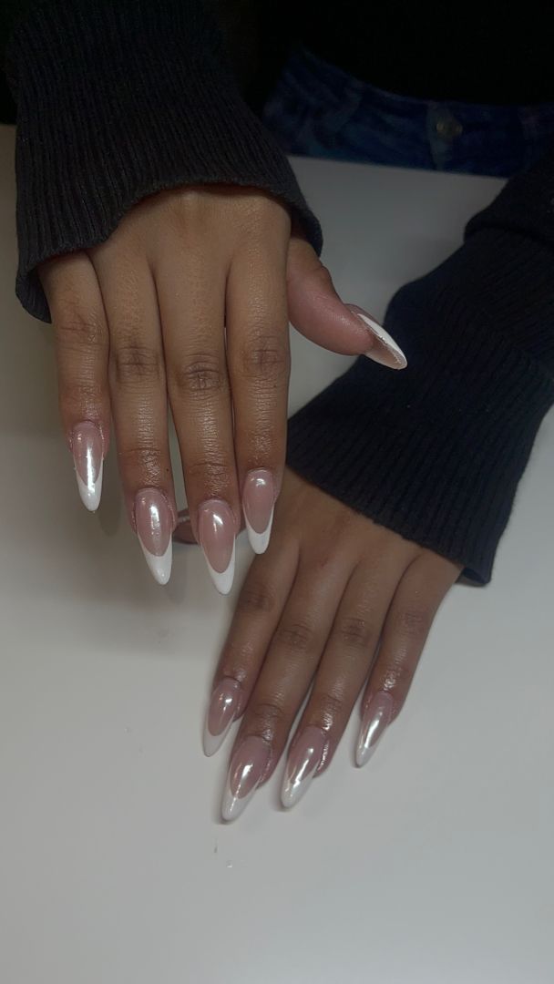 Chic Almond-Shaped Nails: Sophisticated Nude Base with Elegant White Tips.