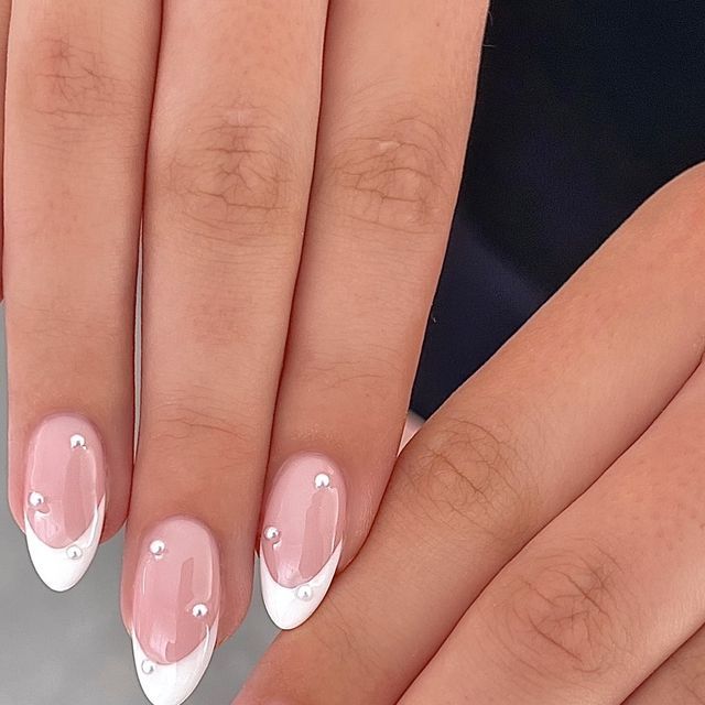 Sophisticated Soft Pink and Glossy White Nail Design with Rhinestone Embellishments