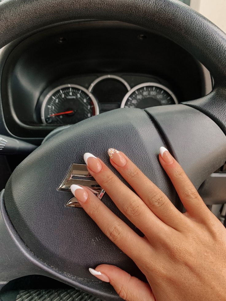 Sophisticated French Tip Nails with Elegant Nude Base and Subtle Sparkle.