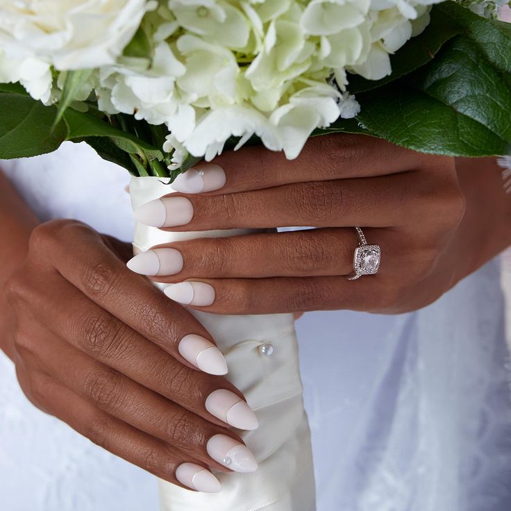 Sophisticated Almond-shaped Bridal Nails with Glossy Finish and Timeless White Polish.