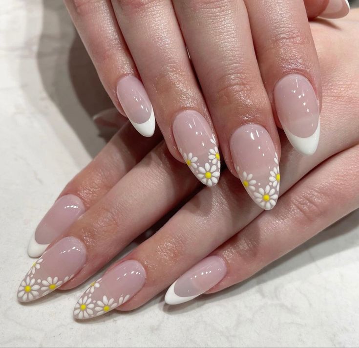 Delicate Floral-Inspired Manicure with White French Tips and Daisies for a Fresh Spring Aesthetic.