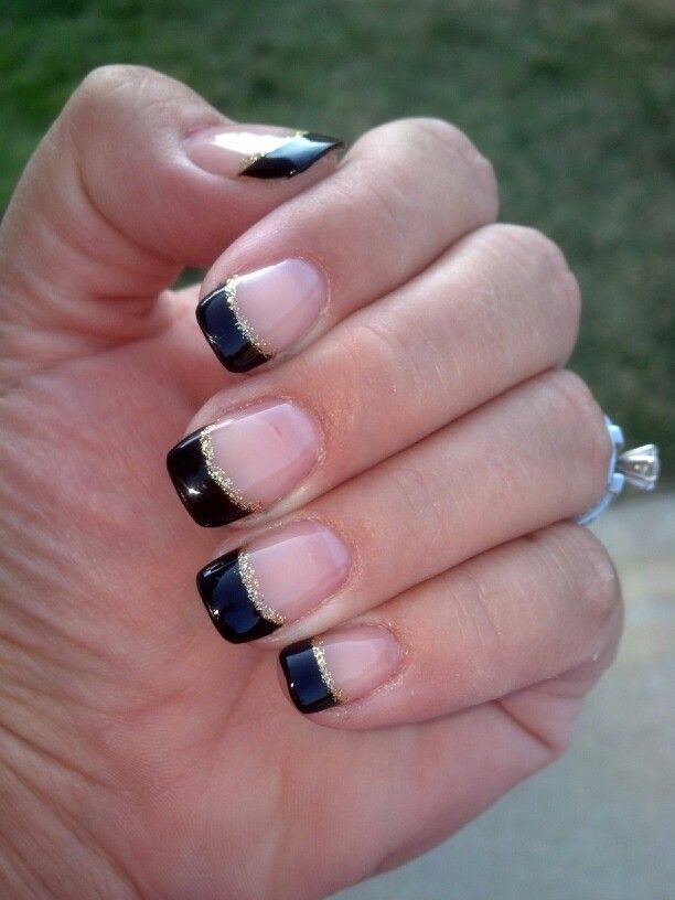 Sophisticated French Tip Nail Design with Glossy Black Tips and Gold Accent.