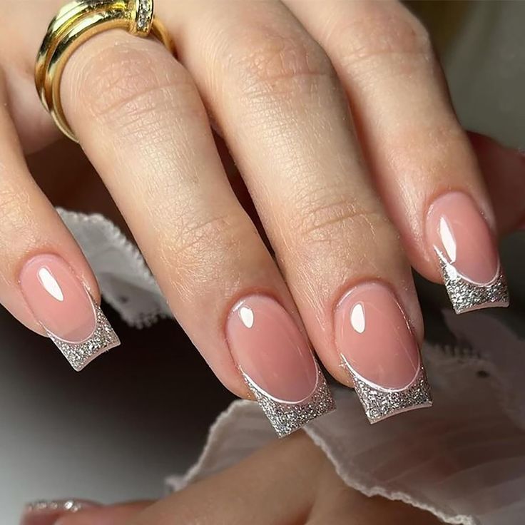 Chic Soft Pink Manicure with Sparkling Silver French Tips for Elegant Occasions.