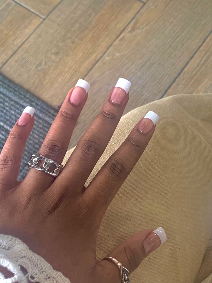 Sophisticated French Manicure with Elegant Silver Accents.