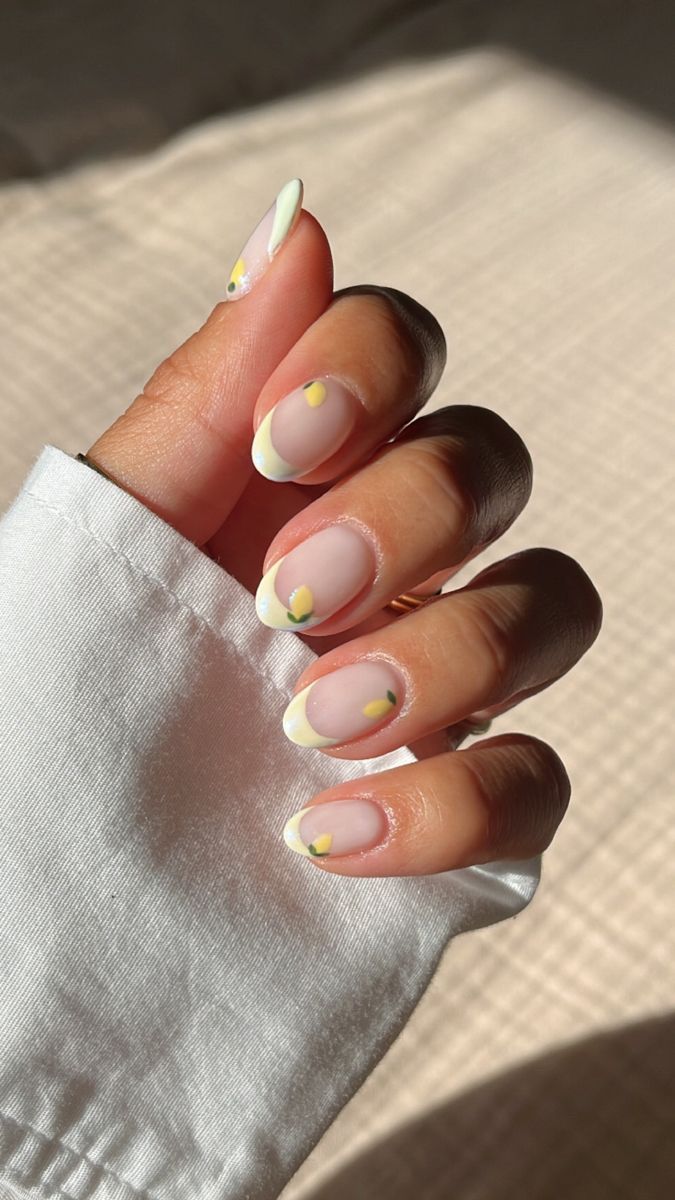 Elegant Nude Nail Design with White Tips and Playful Yellow Accents