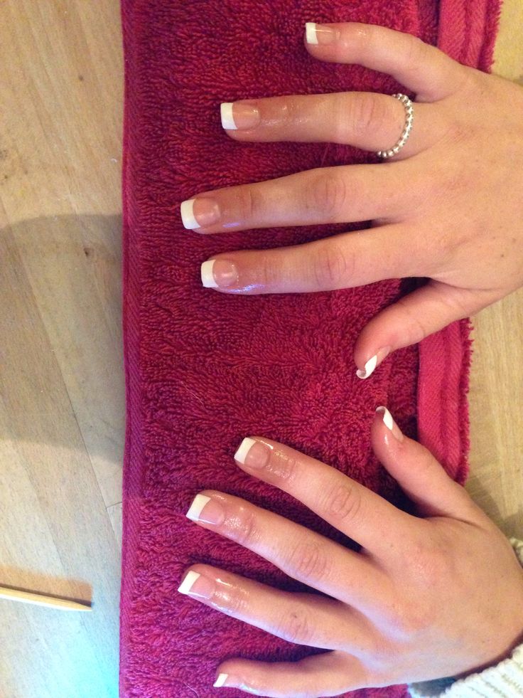 Timeless Elegant French Manicure: Classic White Tips on Natural Nails, Perfect for Any Occasion.