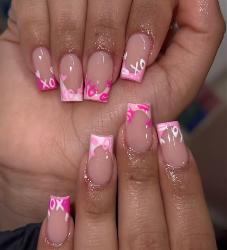 Romantic Chic Nail Design: Nude and Vibrant Pink with Heart Patterns and Glossy Finish