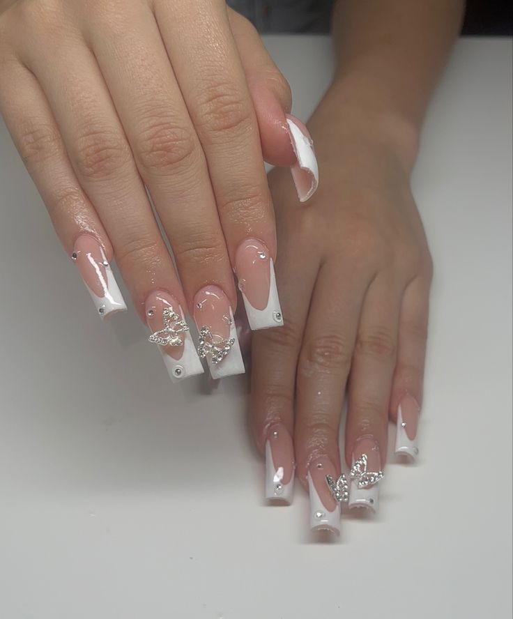 Chic French Manicure: Glossy Long Squared Tips with Silver Embellishments and Rhinestones.