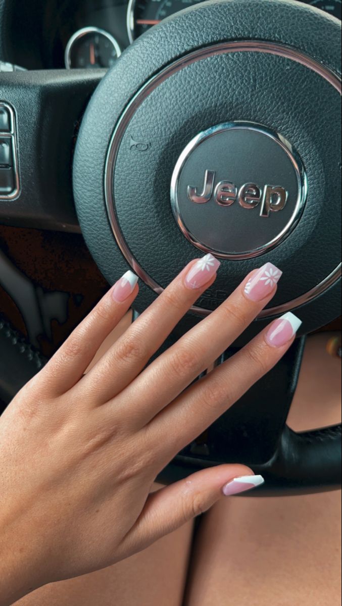 Chic Floral-Accent Soft Pink Nail Design with Elegant White Tips.