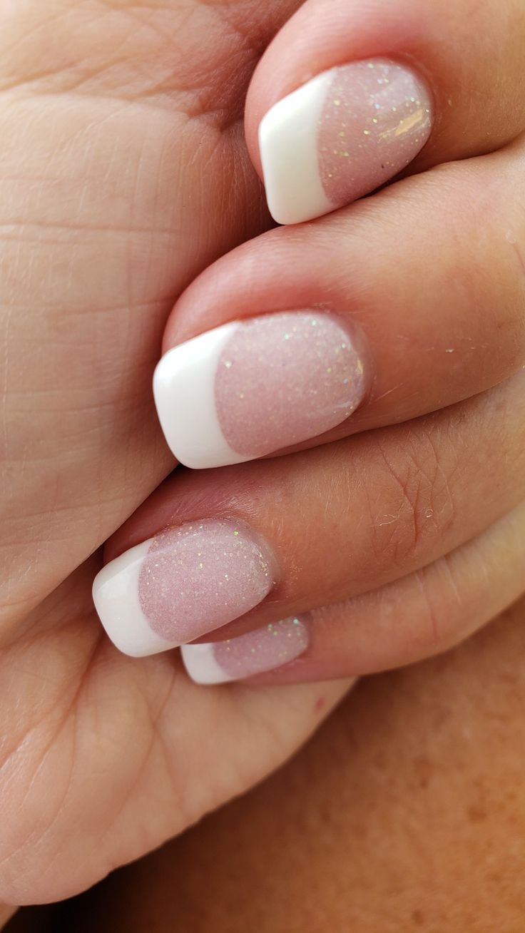 Elegant Soft Pink and White Tip Nails with Glamorous Sparkling Finish