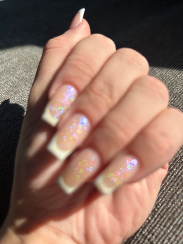 Whimsical Elegance: Delicate French Manicure with Iridescent Glitter