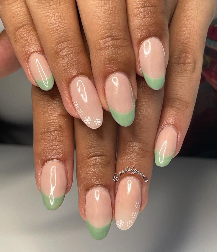 Chic Nude and Mint Green French Tip Nail Design with White Floral Accents