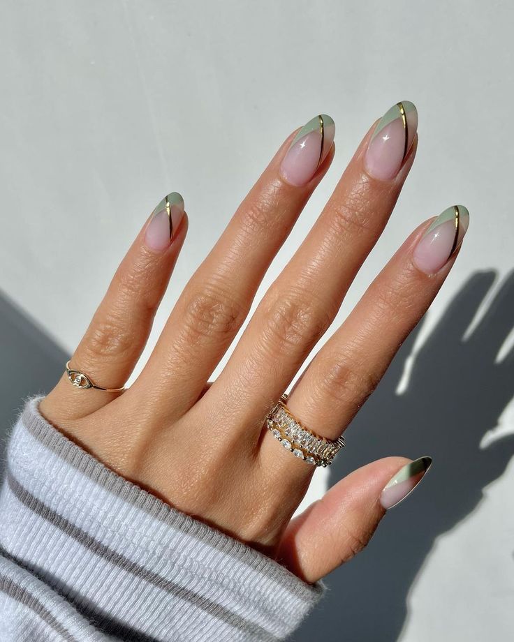 Chic Olive Green French Manicure with Gold Accents and Almond-Shaped Nails.