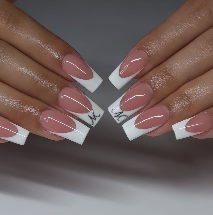 Chic Modern French Tip Nail Design with Glossy Nude Base and Elegant Embellishments