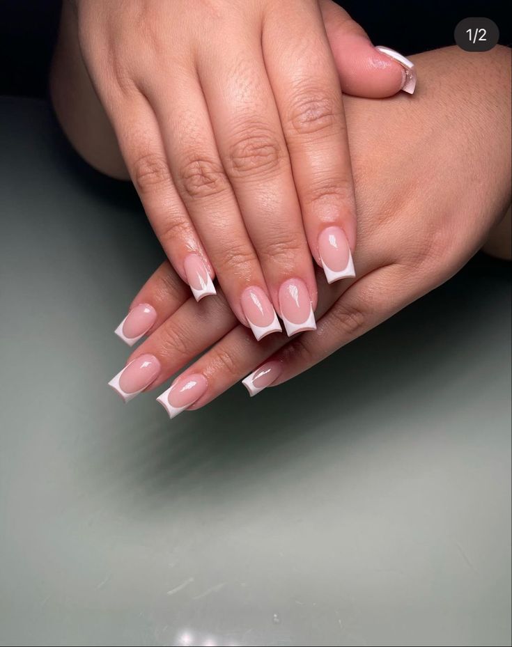 Sophisticated French Manicure: Elegant Nude Nails with Classic White Tips.