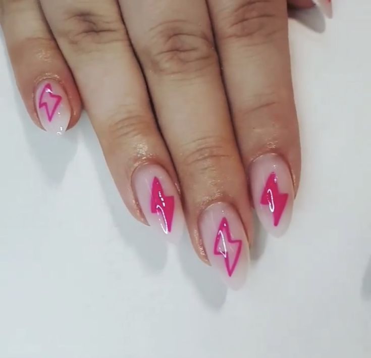 Vibrant Pink Lightning Bolt Nail Art on a Nude Base: A Fun and Energetic Look.