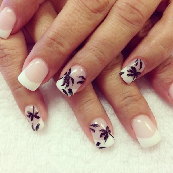 Chic Tropical French Tip Nail Design with Elegant Black Palm Tree Motifs.