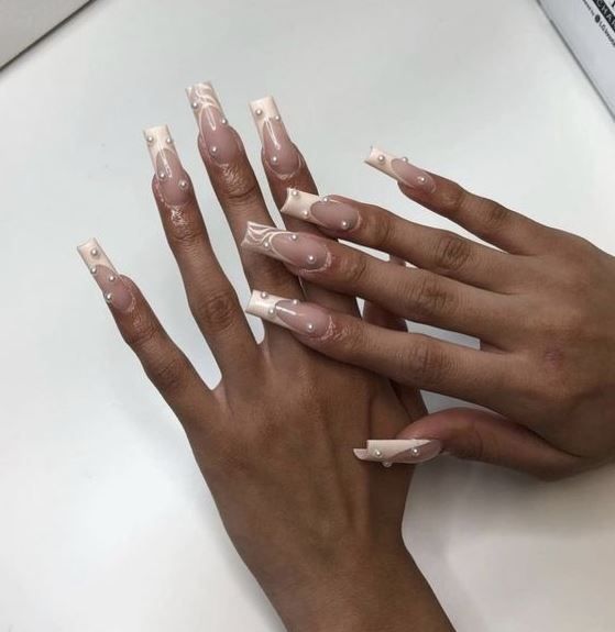 Elegant Glossy Long Nails with Ombre Design and Intricate Art