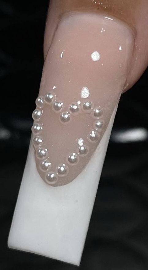 Chic Nude Nail Design with Beaded Heart and Matte White Tips for Romantic Occasions