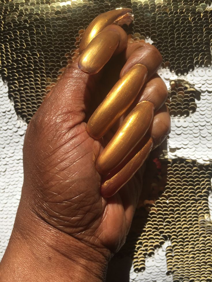 Elegant Gold Metallic Almond Nail Design: A Bold Glamour for Any Occasion.