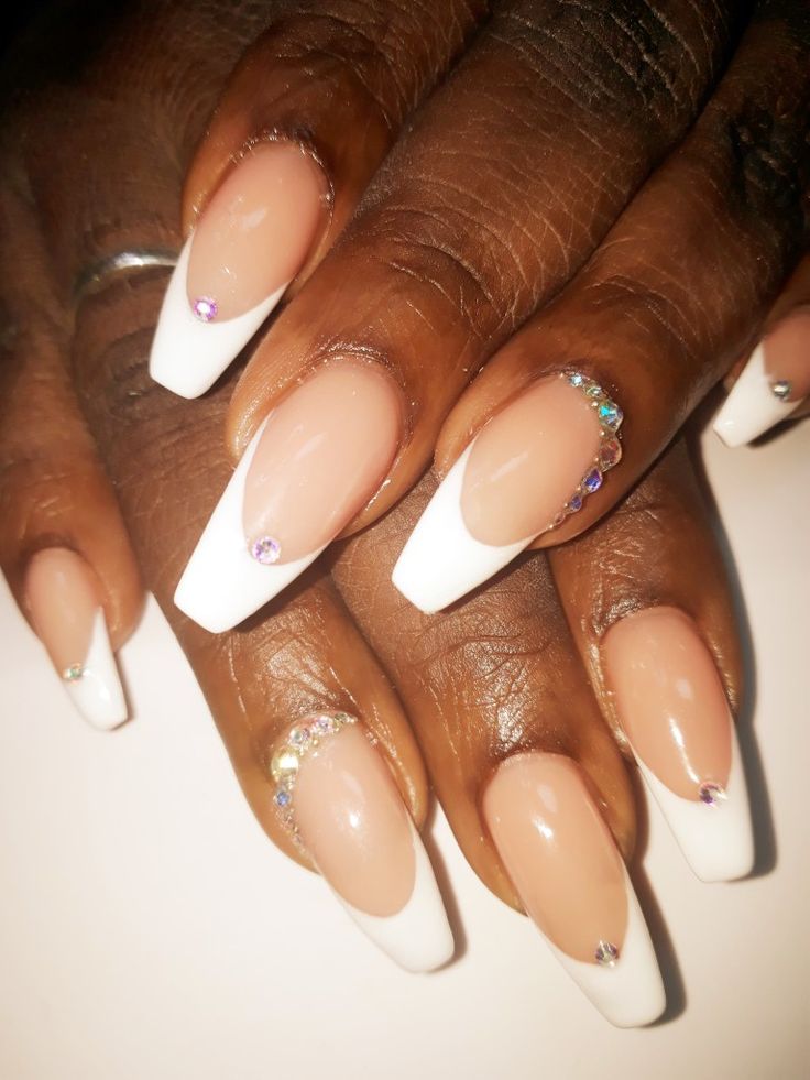 Sophisticated French Manicure with Rhinestones: Classic White Tips and Soft Nude Base.