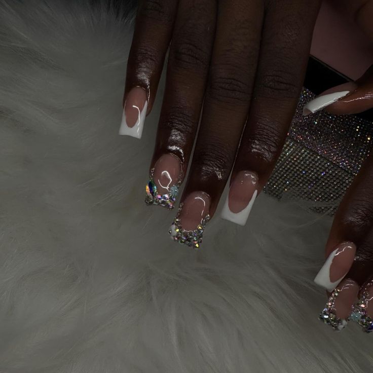 Chic Nude and White French Tip Nails with Glamorous Rhinestone Accents