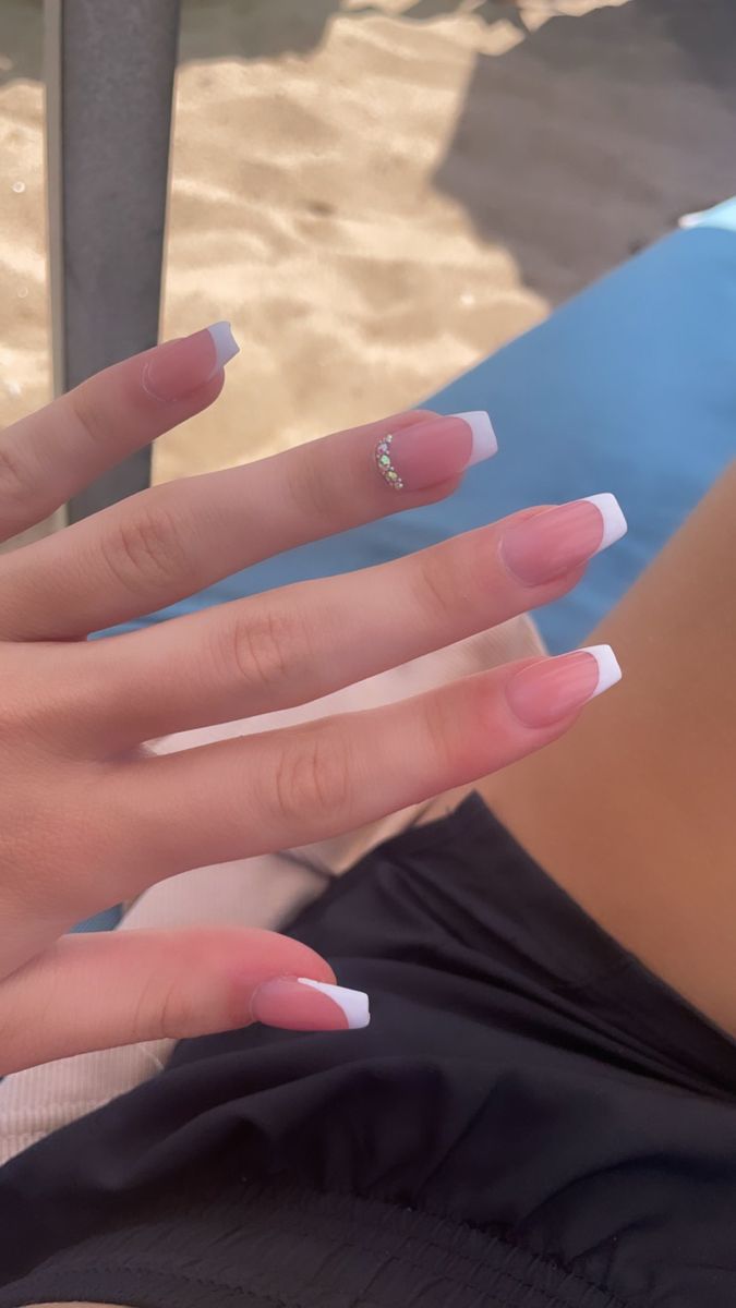 Chic French Manicure with Pink Tones and Rhinestone Accent