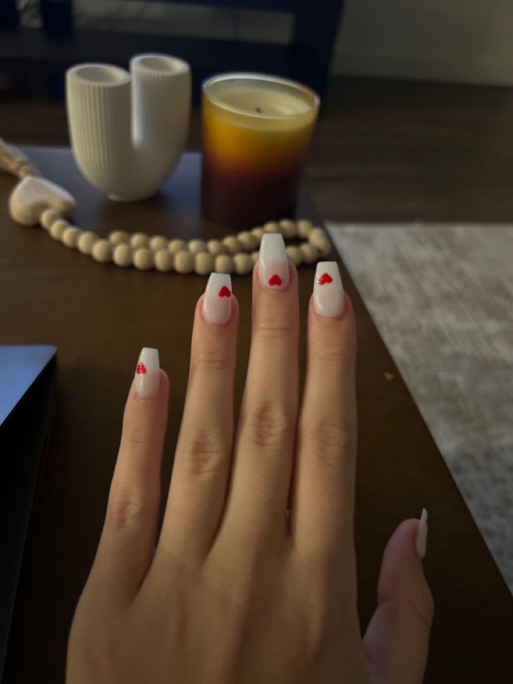 Charming White and Red Heart Nail Design for Romantic Occasions