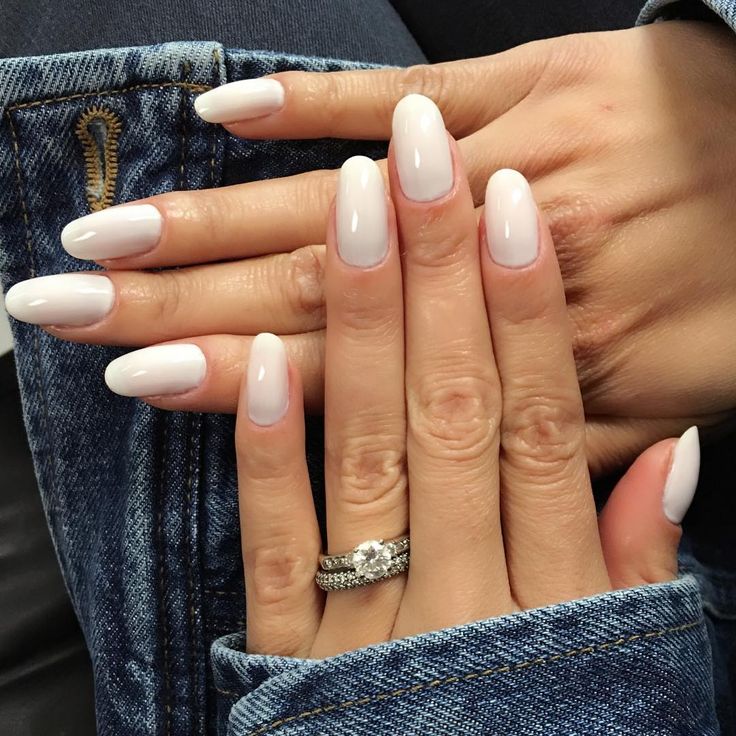 Sophisticated Almond-Shaped White Manicure with Glossy Finish and Gradient Effect, Perfectly Complementing Denim.