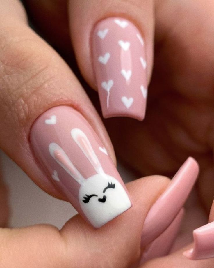 Charming Pastel Pink Nail Design with Whimsical Bunny and Hand-Painted Hearts.