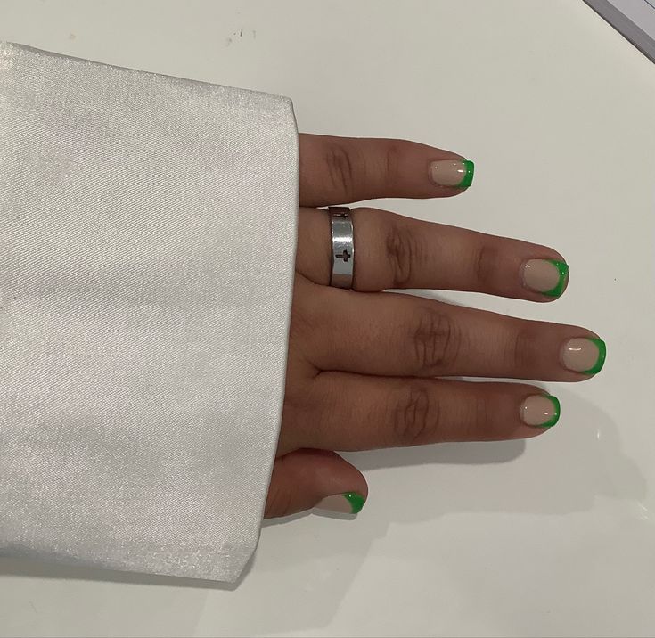 Chic French Manicure: Vibrant Green Tips on a Natural Base for a Modern Look.