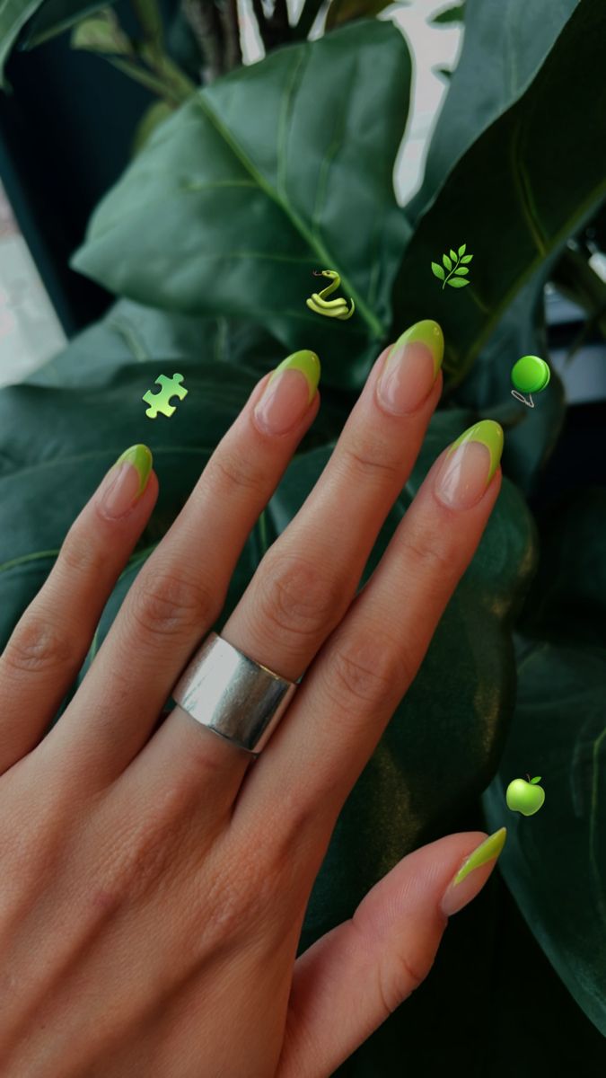 Chic Nail Design with Striking Green Tips and Elegant Shape, Paired with Minimalist Silver Ring.