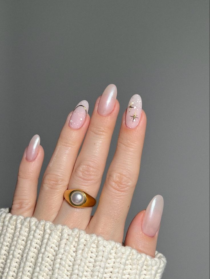 Chic Elegant Nude Nail Design with Soft Pink Accents and Sparkling Elements.