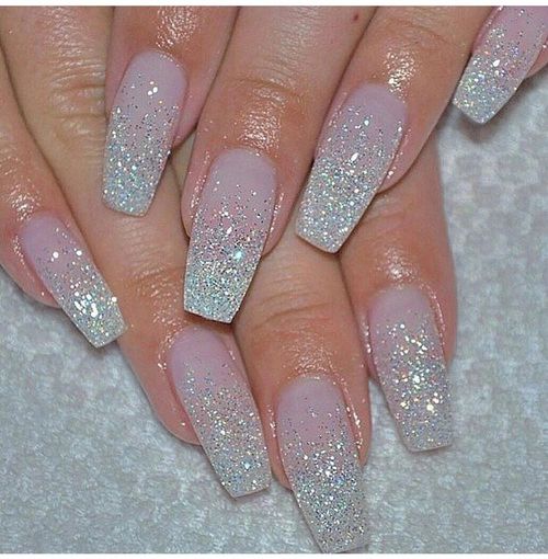 Stunning Sparkling Ombre Nails: Elegant Nude Base with Glittery Gradient for Any Occasion.