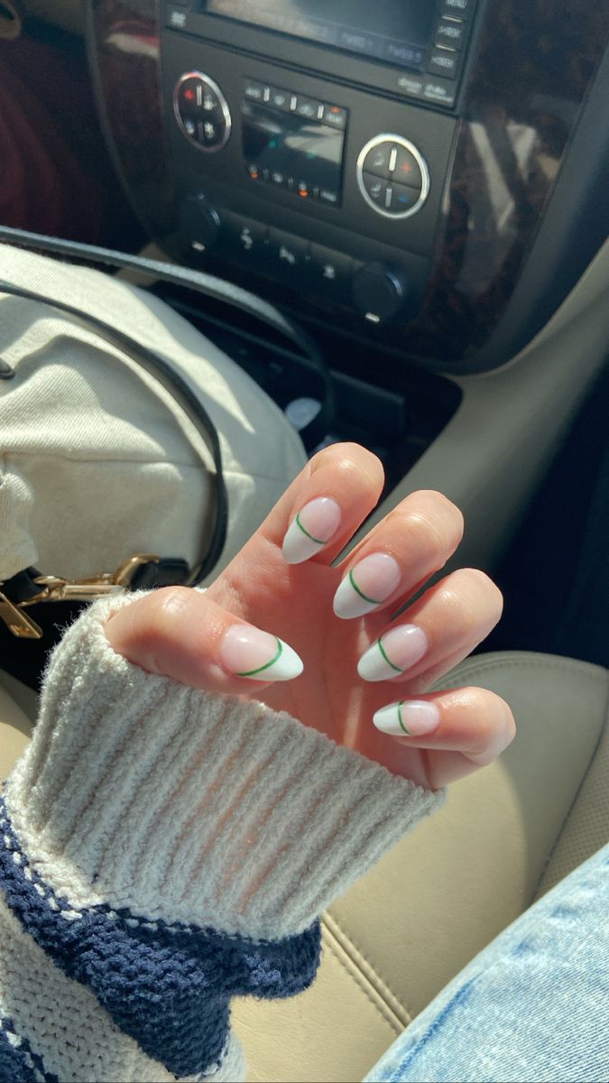 Modern French Tip Nail Design with Playful Green Twist.