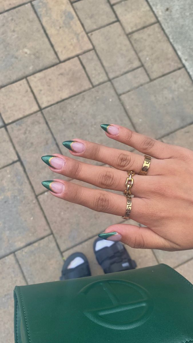 Chic Almond-Shaped Nail Design with Vibrant Green Tips and Sophisticated Accessories.