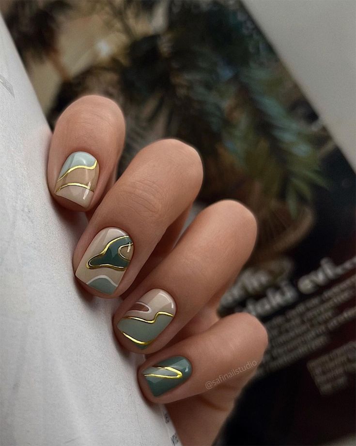 Sophisticated Elegant Nail Design with Muted Earthy Tones and Gold Accents