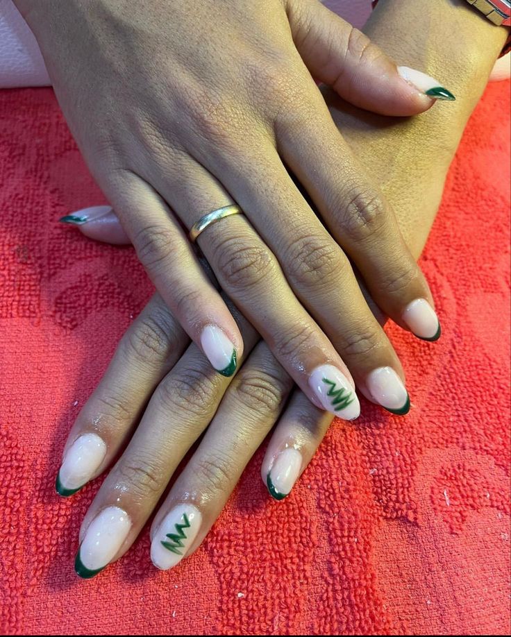 Sophisticated Nail Design: Natural Base with Dark Green Tips and Whimsical Zigzag Accents.