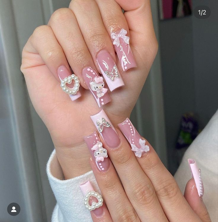 Delightful Whimsical Nail Design in Soft Pinks with Charming Embellishments and Elegant Textures.