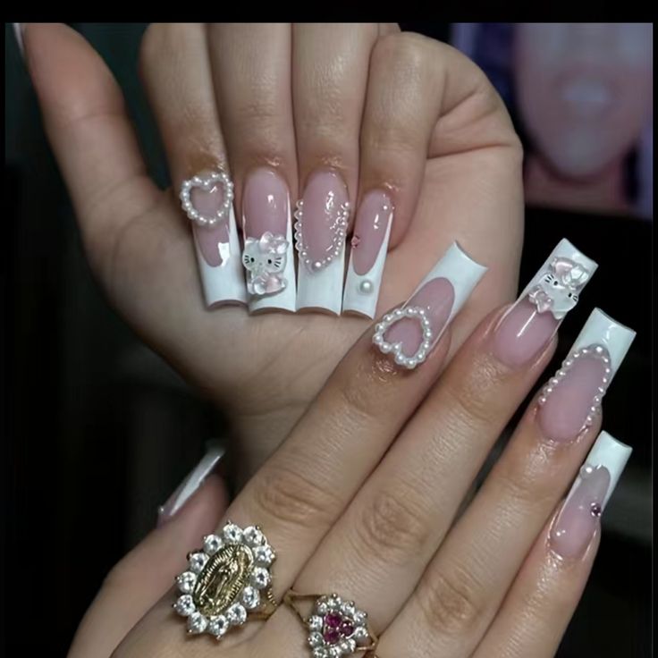 Chic Nail Design: Playful Pink and Glossy White with Intricate Embellishments