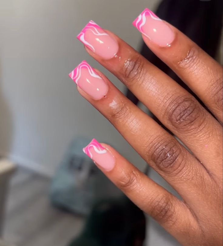 Elegant Acrylic French Tip Nails with Playful Pink Swirls