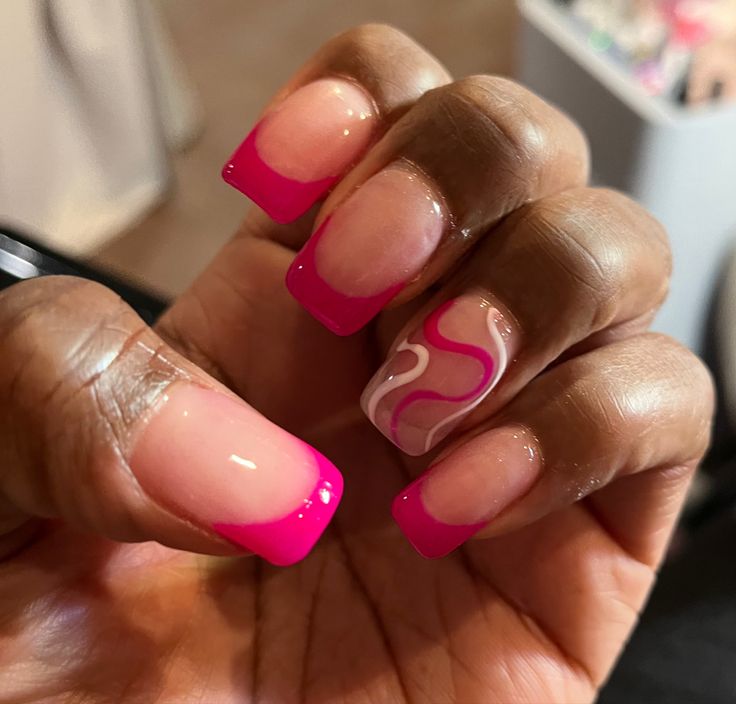 Chic Ombre Pink French Tip Nail Design with Playful Accent Swirls