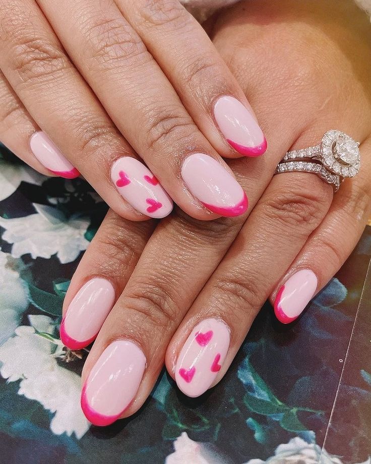 Whimsical French Manicure: Soft Pink Base with Bright Pink Tips and Heart Accents.