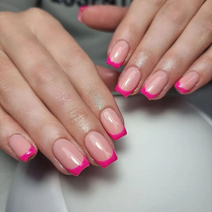 Vibrant Pink-Tipped Nude French Manicure: A Chic and Versatile Nail Design.