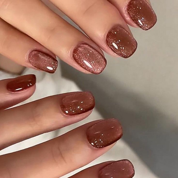 Elegant Glistening Brown Ombre Nails with Sparkling Gradient Effect