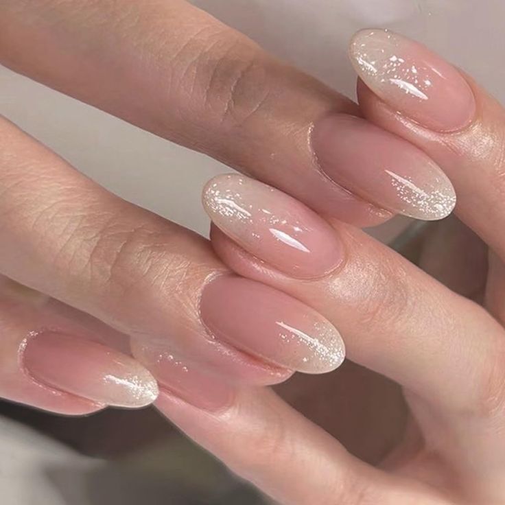 Sophisticated Gradient Nail Design: Natural Pink Base to Shimmering White Tip